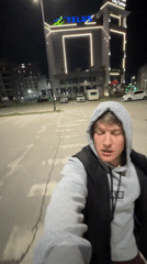 Young man films himself outdoors at night in Plovdiv