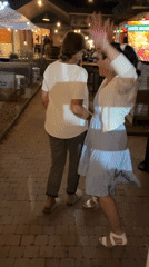 Evening patio gathering features live saxophone music and dancing