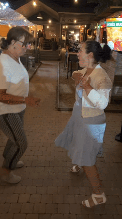 Evening patio gathering features live saxophone music and dancing