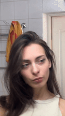 Woman takes selfies in multiple rooms, Krasnoyarsk morning