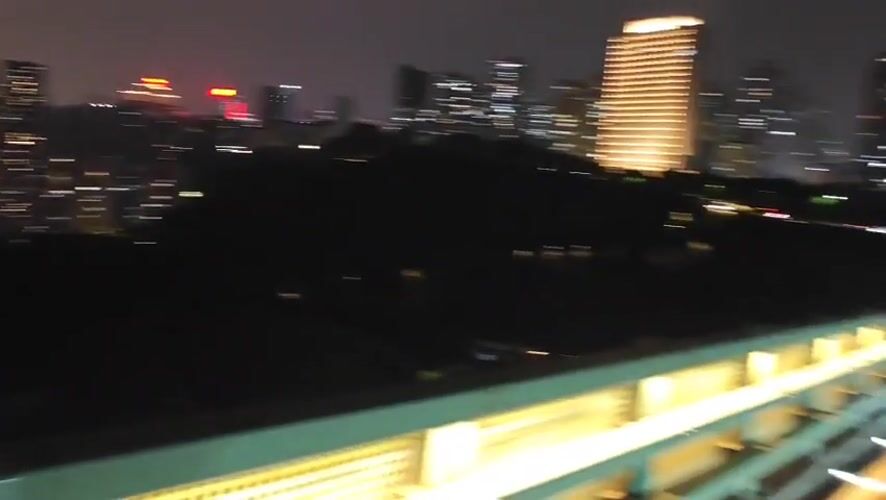 Night traffic and illuminated walkways observed in Chongqing district