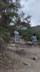 Hikers traverse mountain trail in Kemer forest area