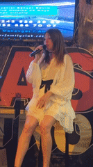 Woman performs musical set at bar venue