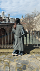 Woman views historic domed architecture in Istanbul's Beyoğlu district