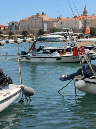 Budva's marina and Old Town on a busy summer afternoon