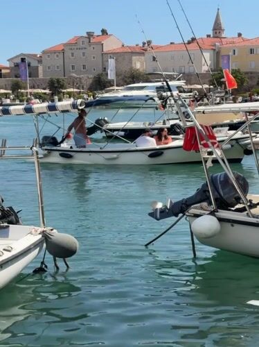 Budva's marina and Old Town on a busy summer afternoon