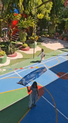 Flag spinning practice captured in sunny Kuta Selatan schoolyard