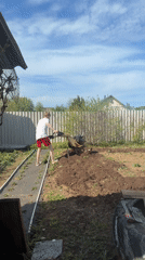 Spring gardening activity observed in rural Russian backyard
