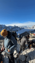 Trekkers spotted on mountain ridge near Khumjung, Nepal