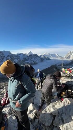 Trekkers spotted on mountain ridge near Khumjung, Nepal