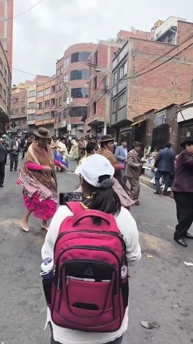 Traditional street parade with dancers and musicians in La Paz