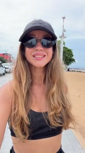 Woman films selfie video near Pattaya beach area