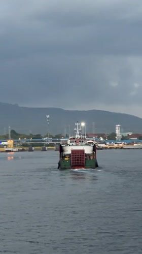 Ferry departure and port activity along the Melaya waterfront