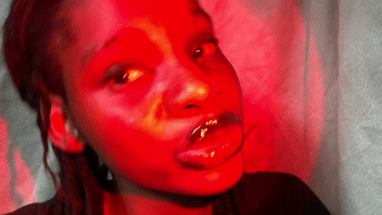 Portrait session captured woman in dramatic red lighting