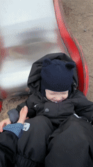 Toddler plays at playground and soccer field in Saint Petersburg