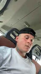 Man in baseball cap observed in vehicle passenger seat