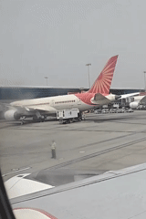 Morning ops at Delhi's IGI Airport — aircraft, ground crews, and terminals