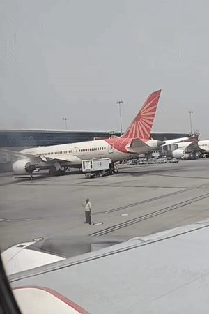 Morning ops at Delhi's IGI Airport — aircraft, ground crews, and terminals