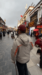 Religious prostrations observed on busy Lhasa street in Tibet