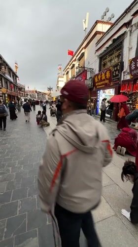 Religious prostrations observed on busy Lhasa street in Tibet