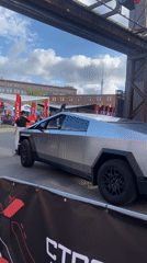 Tesla Cybertruck and costumed characters at an outdoor exhibition