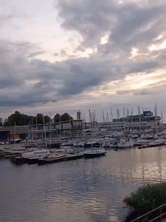 Tallinn marina and medieval ruins on an overcast summer evening