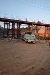 Bridge construction in progress along a rural Tersono river crossing