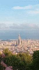 Elevated views capture Barcelona cityscape with Sagrada Familia visible