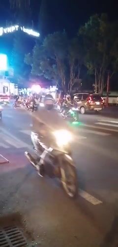 Decorated vehicle parade with motorcycle escort in Da Lat
