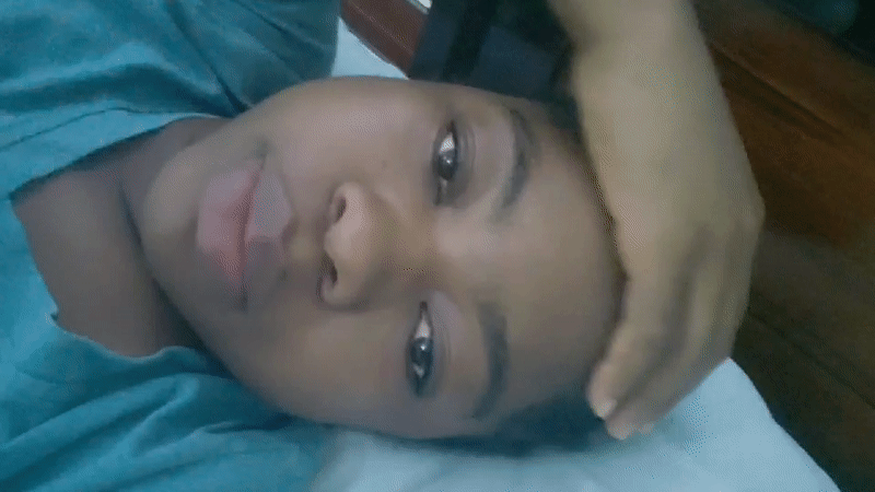 Person photographed resting on pillow in Nigeria morning