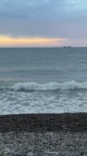 Evening beach moments captured along Montenegro's pebbled coastline