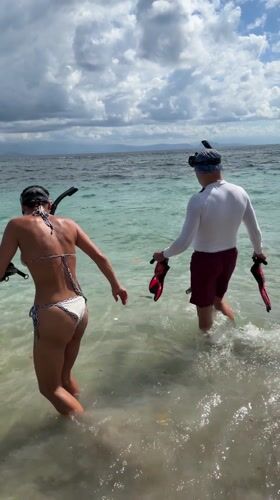 Couple begins early morning snorkeling session off Nusa Penida