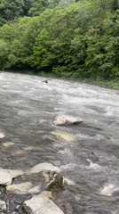 Woman documents riverside visit in Sochi recreational area