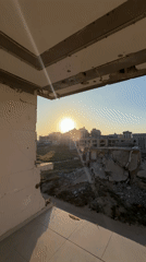 Damaged building documented at sunset in Gaza