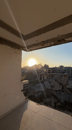 Damaged building documented at sunset in Gaza