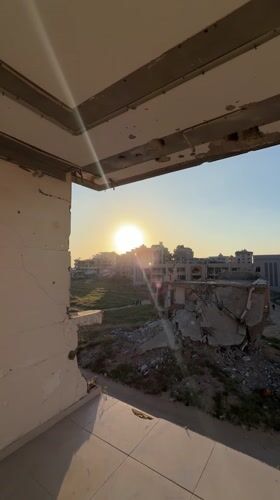 Damaged building documented at sunset in Gaza