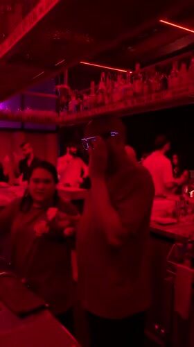 Bar patrons filmed during evening social gathering in Dubai