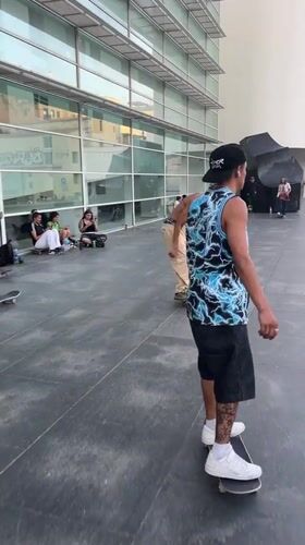 Skateboarding and live street music fill Barcelona's sunny plazas