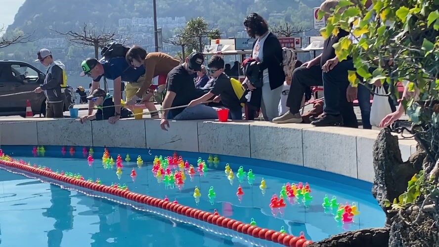 Duck fishing game draws families in Lugano Switzerland