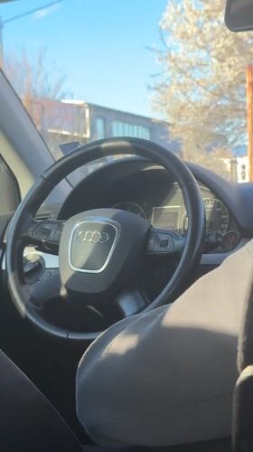 Person documents Audi car interior from backseat in Dobrich