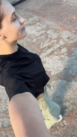 Woman films cheerful video outdoors in Sofia, Bulgaria