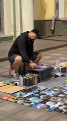 Street artist spray-painting on Nizhny Novgorod's main pedestrian strip
