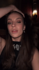 Woman in jeweled necklace photographed in Moscow venue