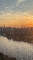 Sunset observed over Moscow skyline and river