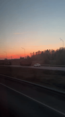 Sunset highway traffic captured on video near Belyi Rast, Russia