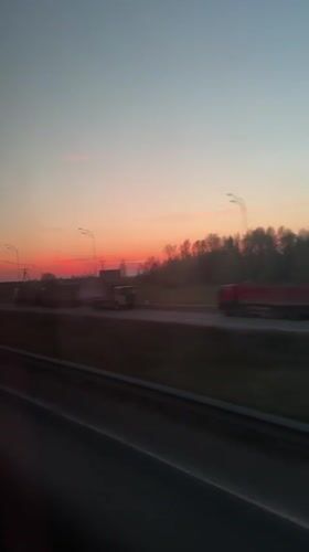 Sunset highway traffic captured on video near Belyi Rast, Russia