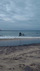 Boat rowing at dusk on Shastrawela beach, Sri Lanka