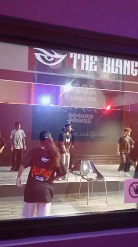 Dance crew rehearses on a lit stage in Pampatar, Venezuela