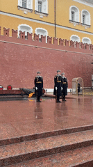 Guards perform ceremonial duties at Moscow's Tomb during snowfall