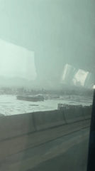 Hazy spring river scene captured in Russian town